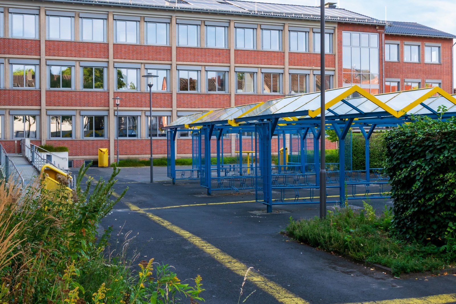 Modern school building with a covered playground area