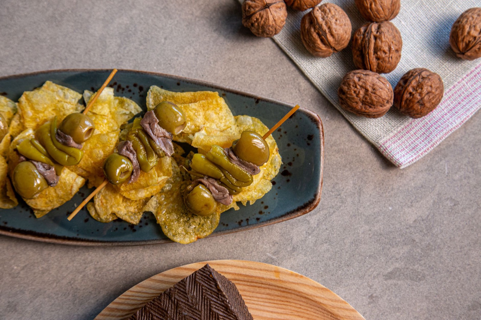 Spanish pintxos with olives and walnuts