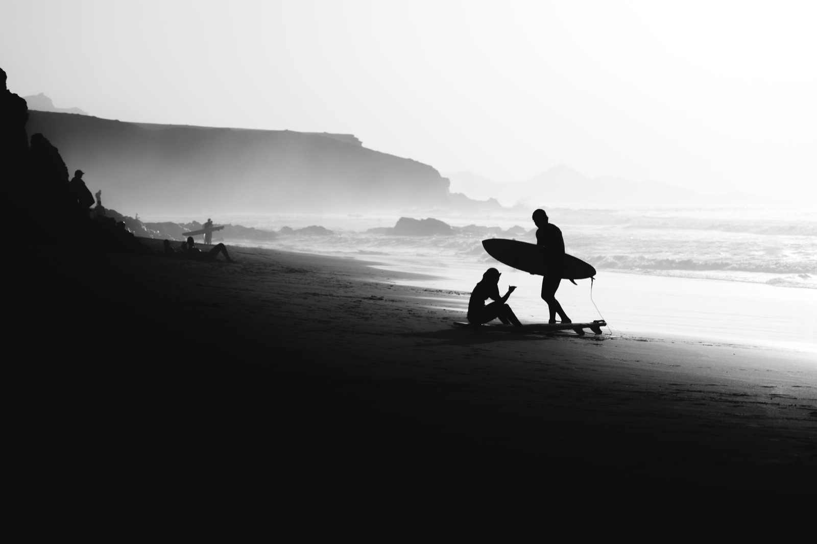 Silhouette of a surfer on the beach