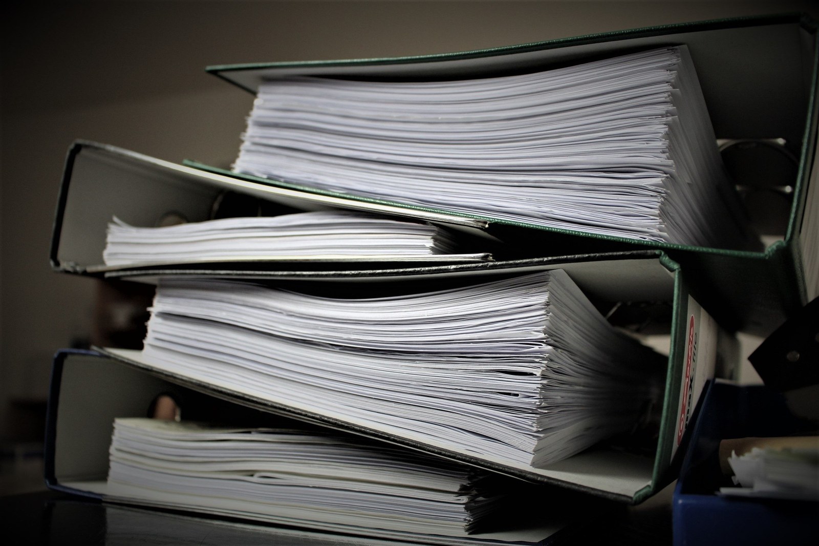 Stack of paperwork binders