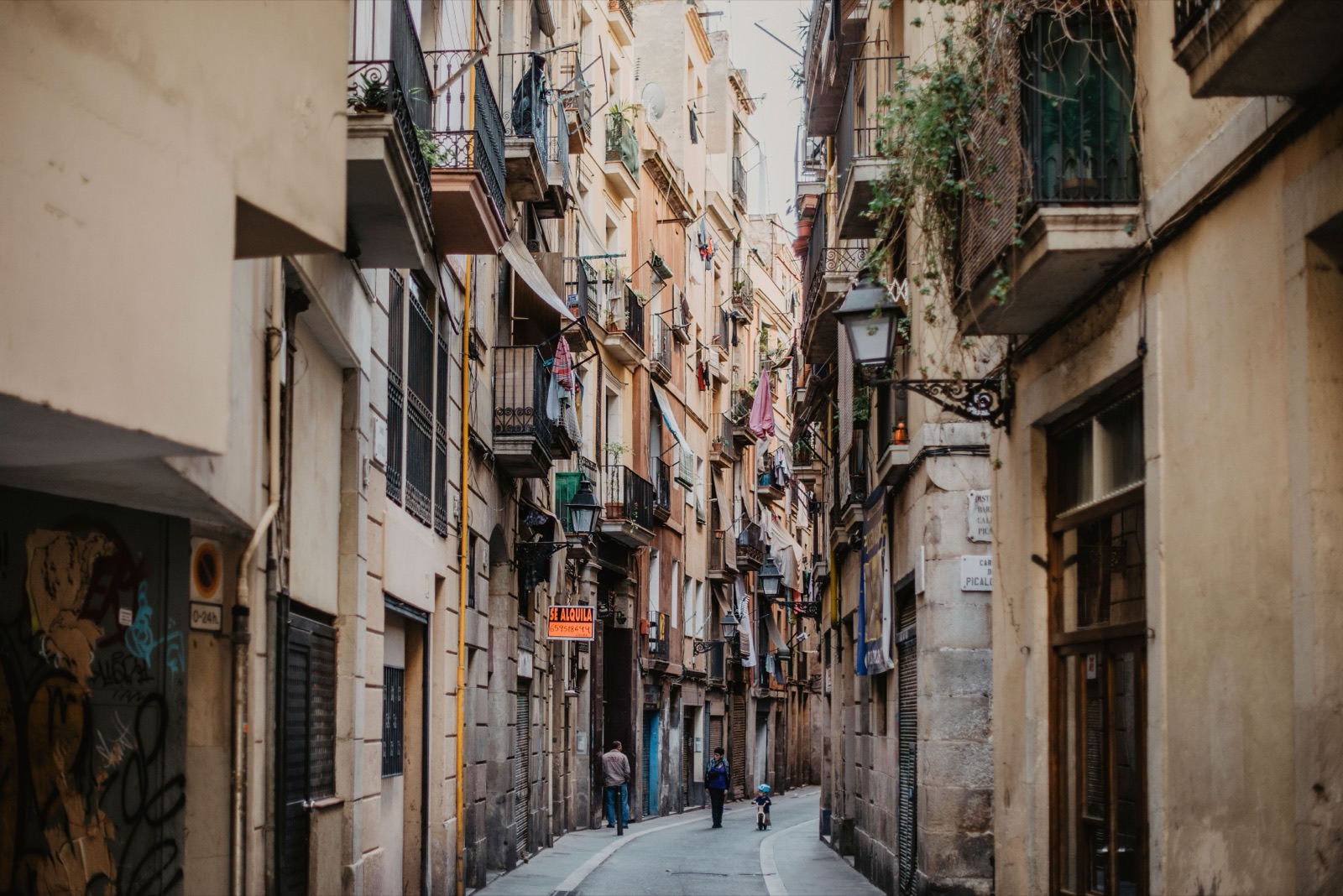 Narrow street lined with balconies in Barcelona's Gothic Quarter